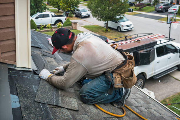 Professional Roofing technician working in Liguori, MO